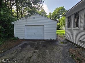 1697 Old Ferry Rd, Hudgins, VA 23076 - detached garage featuring asphalt driveway