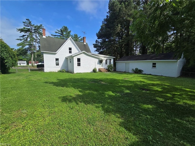 1697 Old Ferry Rd, Hudgins, VA 23076 - view of side of property featuring a yard and a chimney