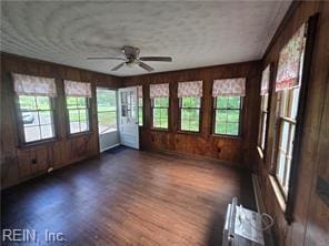 1697 Old Ferry Rd, Hudgins, VA 23076 - unfurnished sunroom featuring french doors, plenty of natural light, wood finished floors, and wood walls