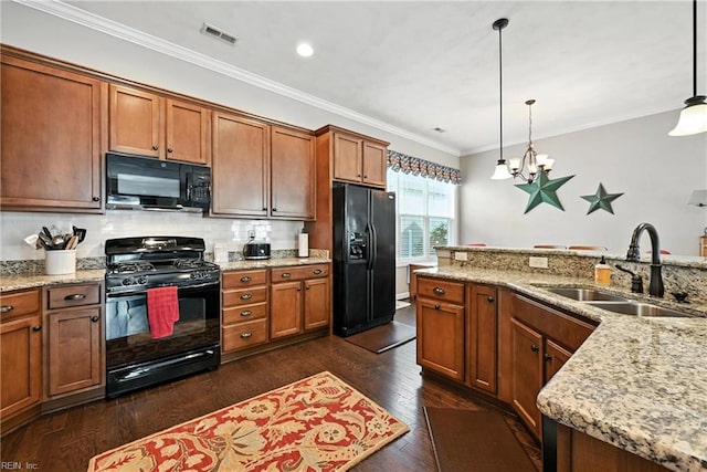 3209 Dodd Dr, Chesapeake, VA 23323 - kitchen featuring black appliances, a chandelier, dark wood-style floors, decorative light fixtures, and brown cabinets