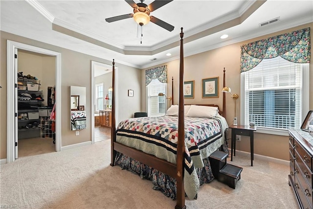 3209 Dodd Dr, Chesapeake, VA 23323 - bedroom featuring a raised ceiling, light carpet, crown molding, a walk in closet, and recessed lighting