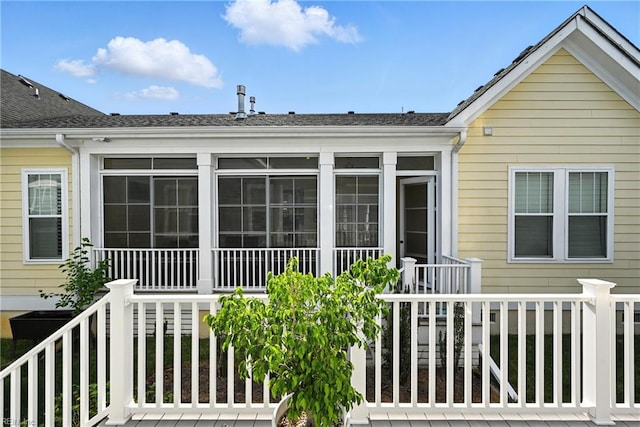 3209 Dodd Dr, Chesapeake, VA 23323 - rear view of property with a shingled roof and a sunroom