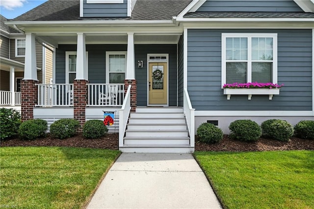 3209 Dodd Dr, Chesapeake, VA 23323 - property entrance featuring a shingled roof, a yard, and a porch