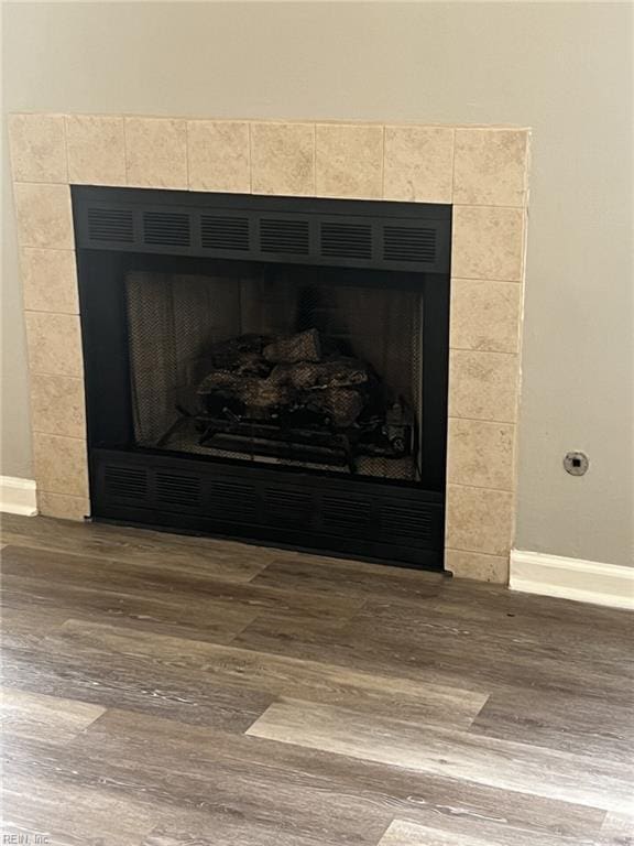 12803 Daybreak Cir, Newport News, VA 23602 - detailed view of a tile fireplace and wood finished floors