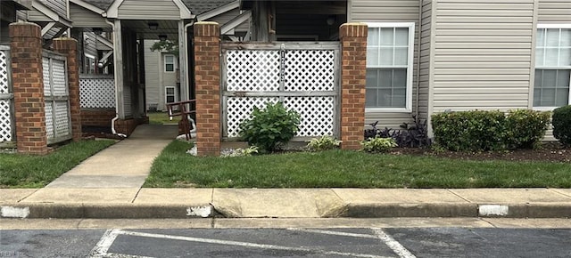 12803 Daybreak Cir, Newport News, VA 23602 - property entrance with uncovered parking and a yard