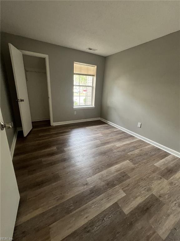 12803 Daybreak Cir, Newport News, VA 23602 - unfurnished bedroom featuring dark wood finished floors and baseboards