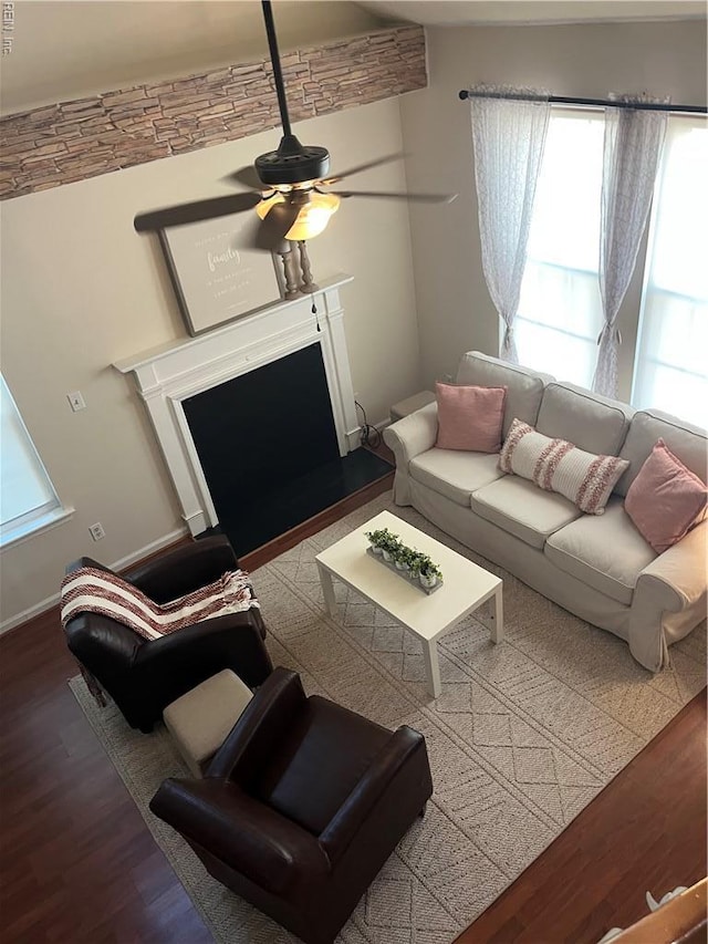 182 Old Bridge Rd, Newport News, VA 23608 - living room with a fireplace with raised hearth, wood finished floors, a ceiling fan, and healthy amount of natural light