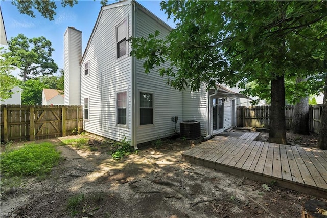 182 Old Bridge Rd, Newport News, VA 23608 - rear view of property featuring a deck, a fenced backyard, and a chimney