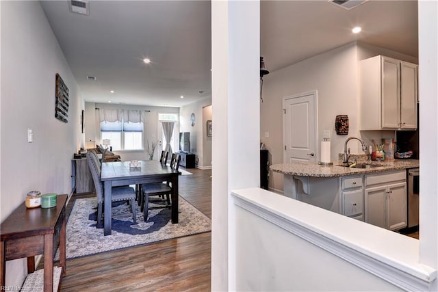 3419 Foxglove Dr, Toano, VA 23168 - kitchen featuring dark wood finished floors, dishwasher, recessed lighting, and light stone countertops