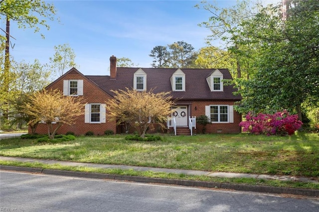 112 Farmington Blvd, Hampton, VA 23666 - cape cod house featuring a chimney, a front lawn, and brick siding