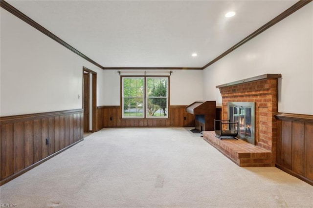 112 Farmington Blvd, Hampton, VA 23666 - unfurnished living room featuring wainscoting, ornamental molding, carpet flooring, a fireplace, and wooden walls