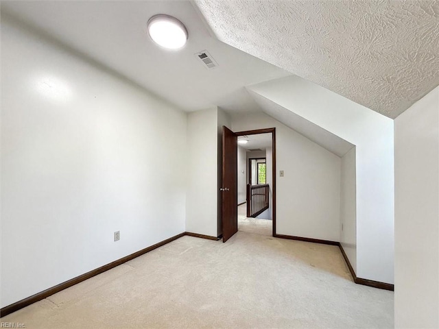 112 Farmington Blvd, Hampton, VA 23666 - bonus room with lofted ceiling, light carpet, and a textured ceiling