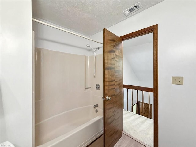 112 Farmington Blvd, Hampton, VA 23666 - bathroom with shower / bath combination, a textured ceiling, and wood finished floors