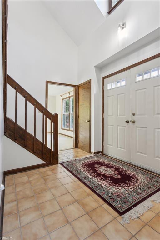 112 Farmington Blvd, Hampton, VA 23666 - entrance foyer featuring high vaulted ceiling, stairway, and tile patterned flooring
