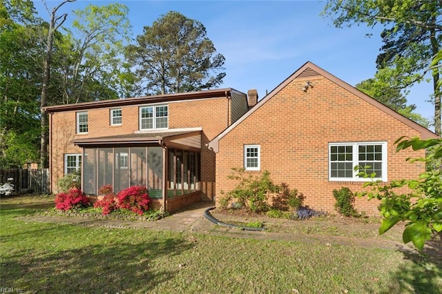 112 Farmington Blvd, Hampton, VA 23666 - back of property featuring a sunroom, brick siding, and a chimney
