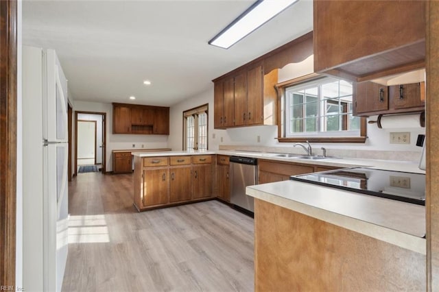 112 Farmington Blvd, Hampton, VA 23666 - kitchen with dishwasher, freestanding refrigerator, light wood-style flooring, brown cabinets, and a peninsula