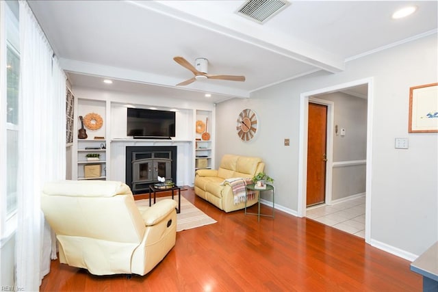 1964 Nettle St, Virginia Beach, VA 23453 - living room with a ceiling fan, a glass covered fireplace, wood finished floors, recessed lighting, and crown molding