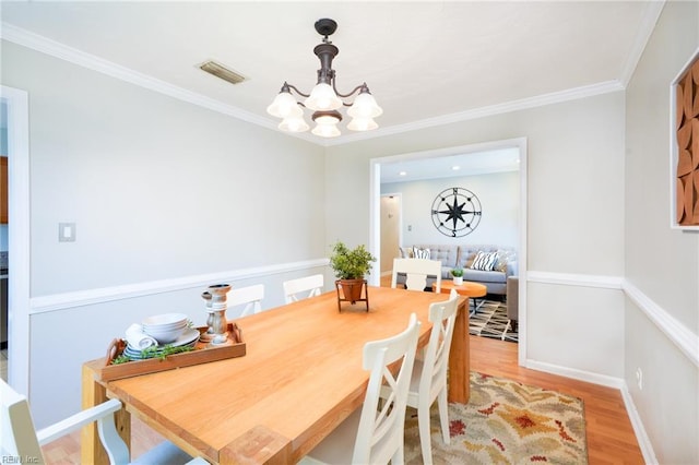 1964 Nettle St, Virginia Beach, VA 23453 - dining space with a chandelier, light wood finished floors, and crown molding
