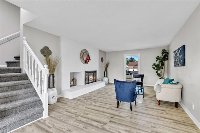 3905 Stonebridge Ct, Chesapeake, VA 23321 - living room featuring light wood-type flooring, stairs, and a glass covered fireplace
