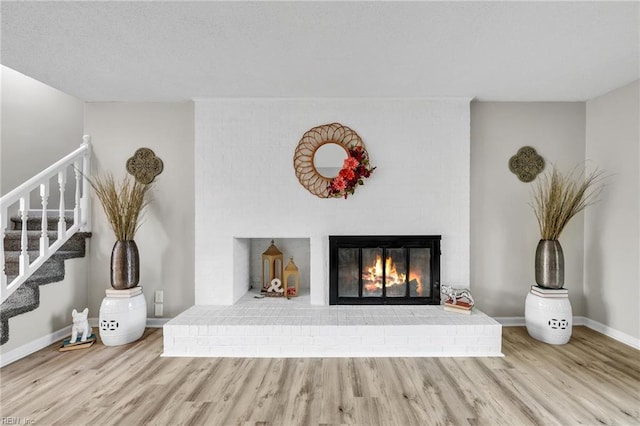 3905 Stonebridge Ct, Chesapeake, VA 23321 - unfurnished living room featuring wood finished floors, stairs, and a fireplace