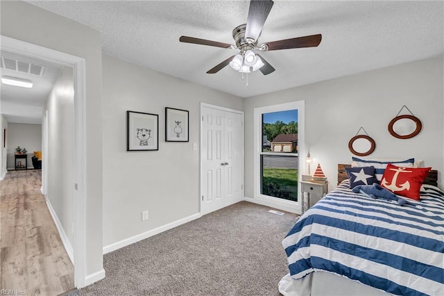3905 Stonebridge Ct, Chesapeake, VA 23321 - carpeted bedroom featuring a textured ceiling and a ceiling fan