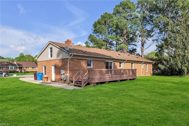 3905 Stonebridge Ct, Chesapeake, VA 23321 - back of property featuring brick siding, a yard, a chimney, and a wooden deck