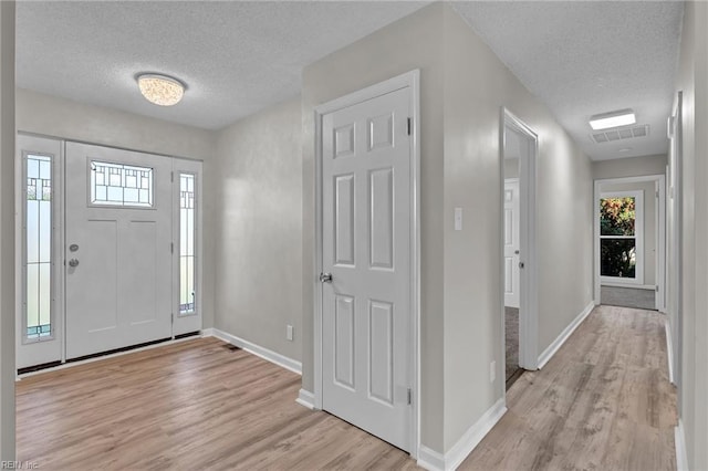 3905 Stonebridge Ct, Chesapeake, VA 23321 - entrance foyer with a textured ceiling and light wood-style floors