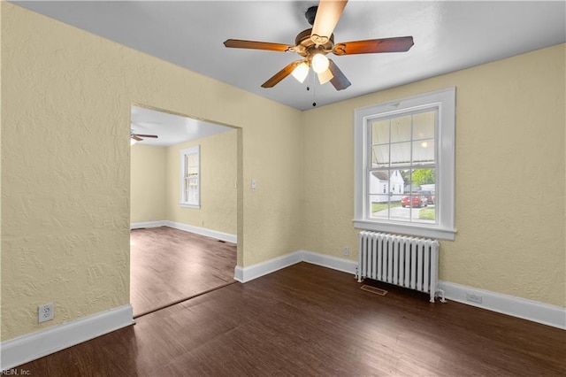 5 Rex Ave, Portsmouth, VA 23702 - unfurnished room with radiator, wood finished floors, a textured wall, and ceiling fan