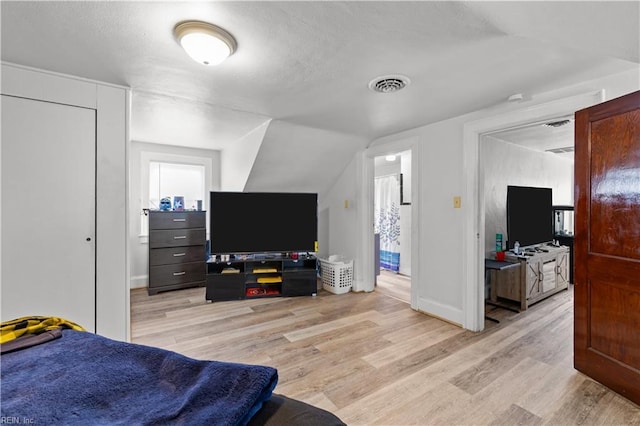 5 Rex Ave, Portsmouth, VA 23702 - bedroom featuring light wood-style flooring, vaulted ceiling, and a textured ceiling