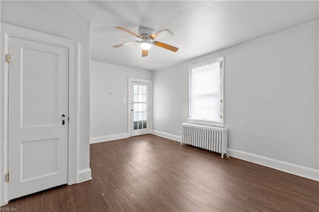 5 Rex Ave, Portsmouth, VA 23702 - empty room with radiator heating unit, a ceiling fan, and wood finished floors