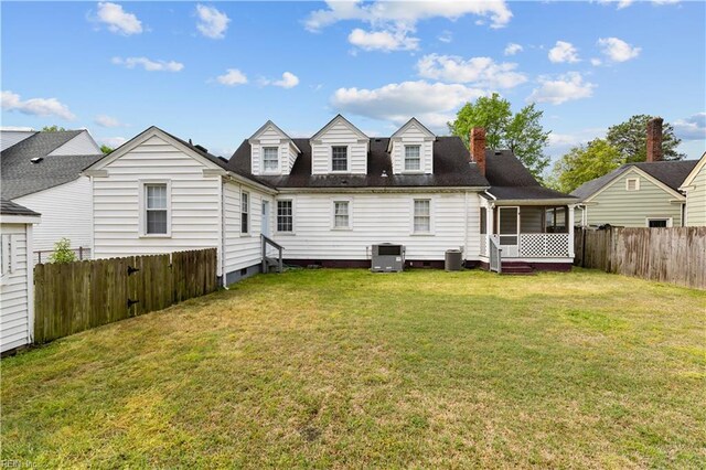 5 Rex Ave, Portsmouth, VA 23702 - back of property featuring a fenced backyard, a chimney, a sunroom, and crawl space