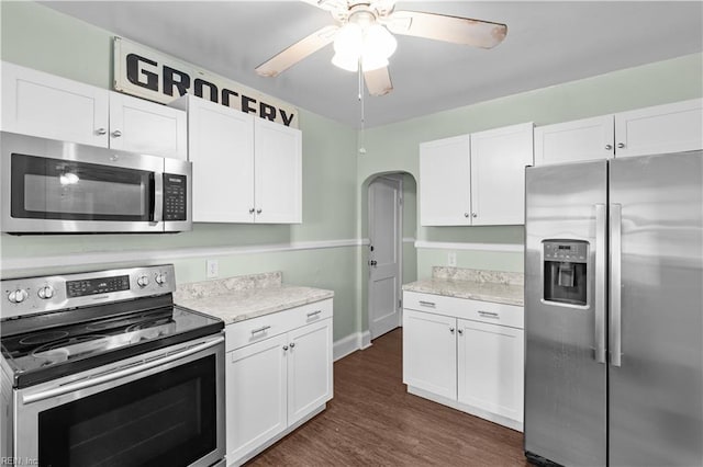 5 Rex Ave, Portsmouth, VA 23702 - kitchen featuring appliances with stainless steel finishes, white cabinets, dark wood-style flooring, and ceiling fan
