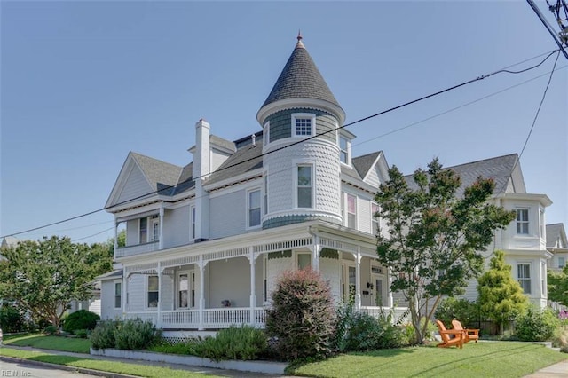 122 S Willard Ave, Hampton, VA 23663 - victorian-style house featuring covered porch, a front lawn, a chimney, and roof with shingles