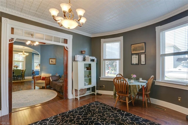 122 S Willard Ave, Hampton, VA 23663 - dining area featuring a chandelier, crown molding, hardwood / wood-style flooring, plenty of natural light, and arched walkways