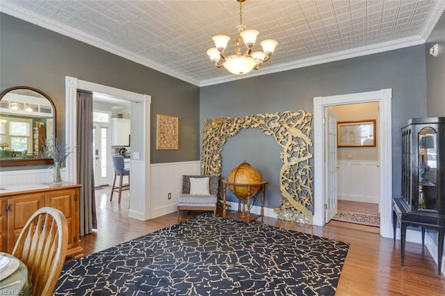 122 S Willard Ave, Hampton, VA 23663 - sitting room featuring a chandelier, wood finished floors, an ornate ceiling, a wainscoted wall, and ornamental molding