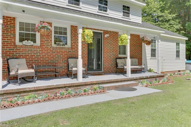 6285 Buckley Hall Rd, Cobbs Creek, VA 23035 - rear view of house featuring brick siding, a lawn, a shingled roof, and a porch