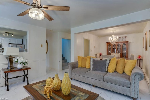 6285 Buckley Hall Rd, Cobbs Creek, VA 23035 - living area with ceiling fan, a chandelier, stairs, and light marble finish flooring