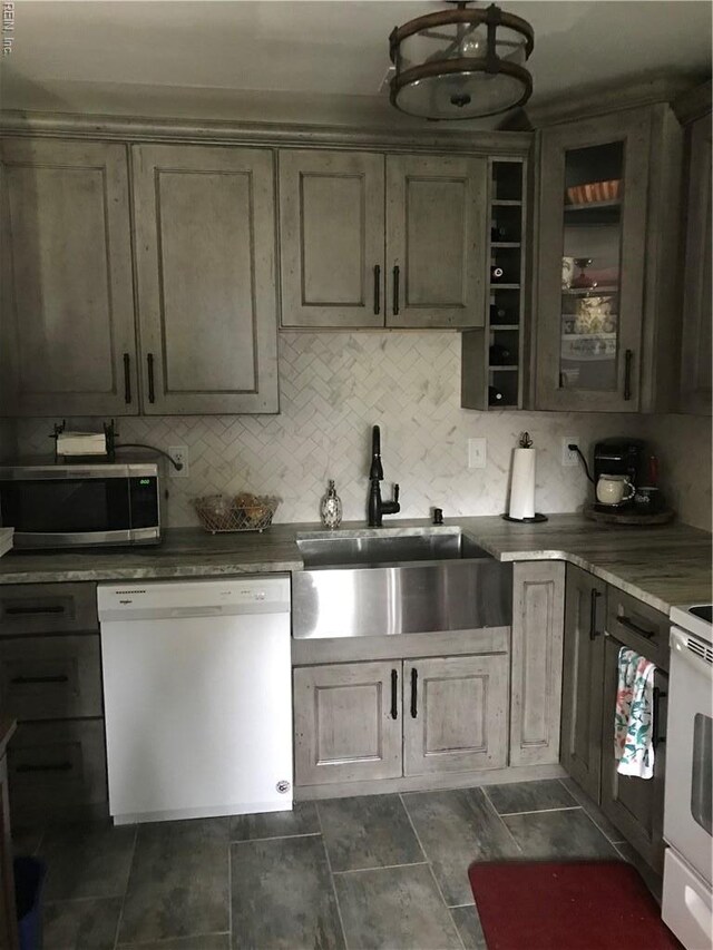 3500 Dana Ln, Virginia Beach, VA 23452 - kitchen with white appliances, decorative backsplash, and glass insert cabinets