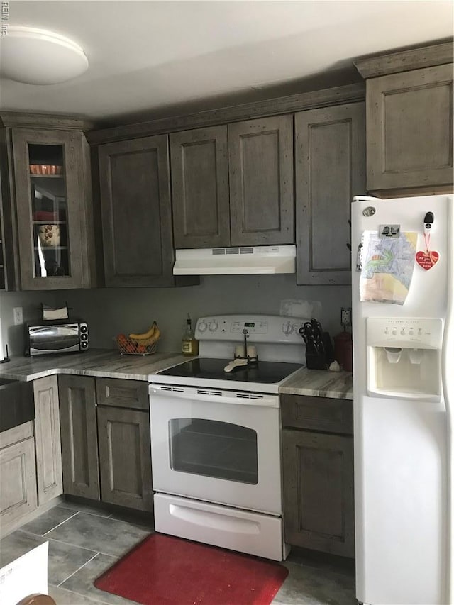 3500 Dana Ln, Virginia Beach, VA 23452 - kitchen featuring white appliances, under cabinet range hood, glass insert cabinets, and light countertops