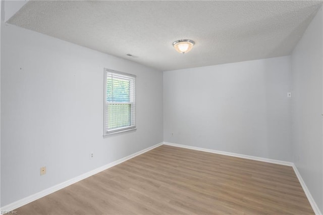 1117 Tibbetstown Ct, Virginia Beach, VA 23454 - spare room featuring light wood-style floors and a textured ceiling