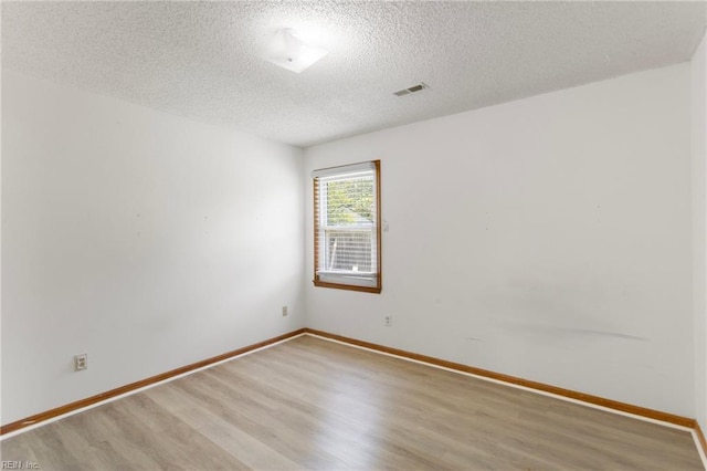 1117 Tibbetstown Ct, Virginia Beach, VA 23454 - empty room featuring a textured ceiling and light wood-type flooring