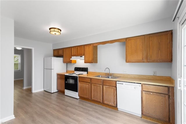 1117 Tibbetstown Ct, Virginia Beach, VA 23454 - kitchen featuring white appliances, under cabinet range hood, light countertops, and brown cabinetry