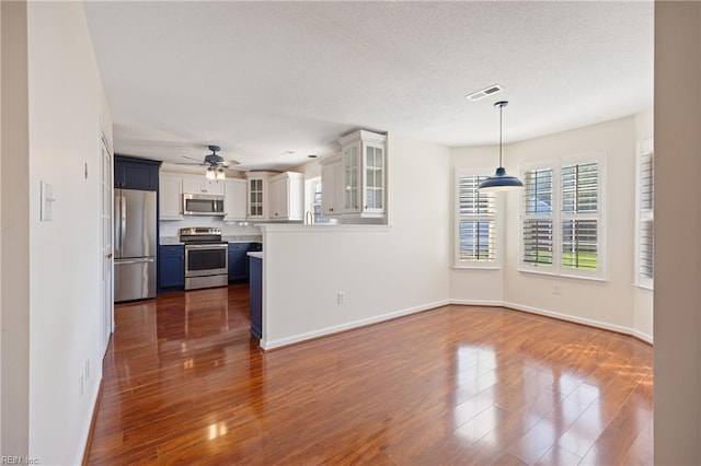 3015 Beech Grove Ln, Suffolk, VA 23435 - unfurnished living room with a ceiling fan, dark wood-style flooring, and a textured ceiling