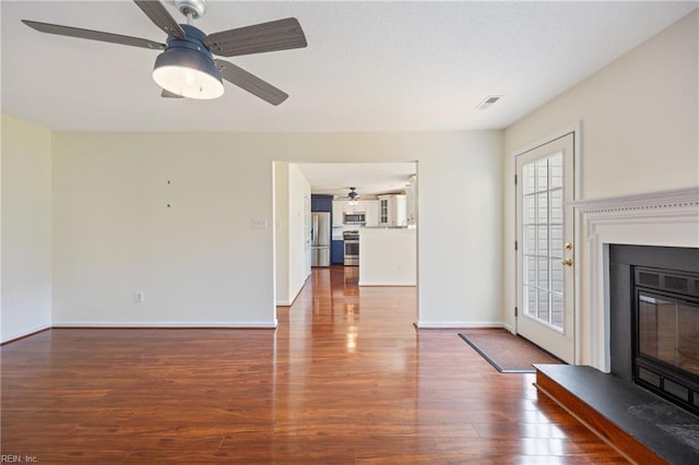 3015 Beech Grove Ln, Suffolk, VA 23435 - unfurnished living room featuring ceiling fan, wood finished floors, and a glass covered fireplace