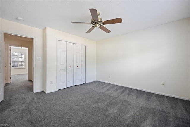 3015 Beech Grove Ln, Suffolk, VA 23435 - unfurnished bedroom with dark carpet, a closet, and a ceiling fan
