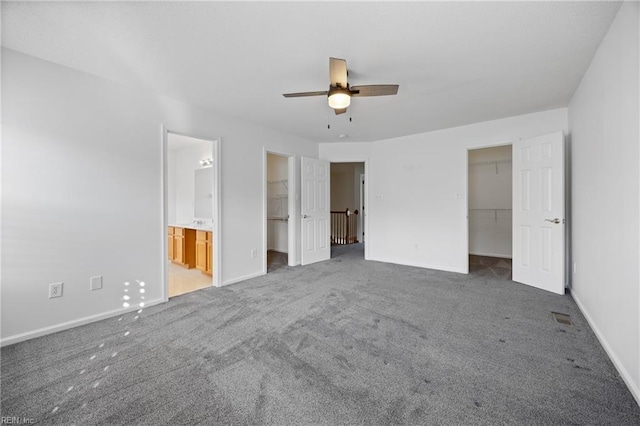 3015 Beech Grove Ln, Suffolk, VA 23435 - unfurnished bedroom featuring a walk in closet, carpet floors, and a closet