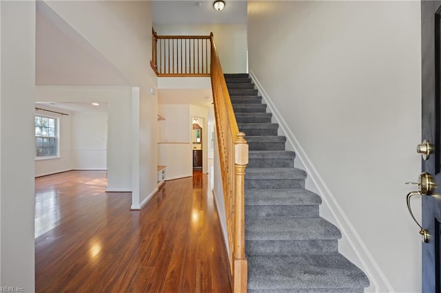 3015 Beech Grove Ln, Suffolk, VA 23435 - staircase featuring a towering ceiling and wood finished floors