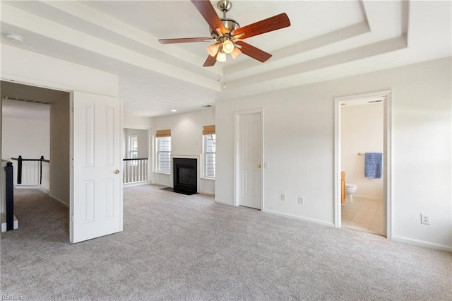 5405 Kiawah Ct, Virginia Beach, VA 23462 - unfurnished living room with a tray ceiling, carpet floors, ceiling fan, and a fireplace with flush hearth