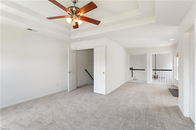 5405 Kiawah Ct, Virginia Beach, VA 23462 - unfurnished room featuring a tray ceiling, light colored carpet, and a ceiling fan