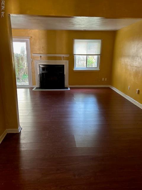 5207 Richard Rd, Virginia Beach, VA 23462 - unfurnished living room featuring dark wood-type flooring and a fireplace